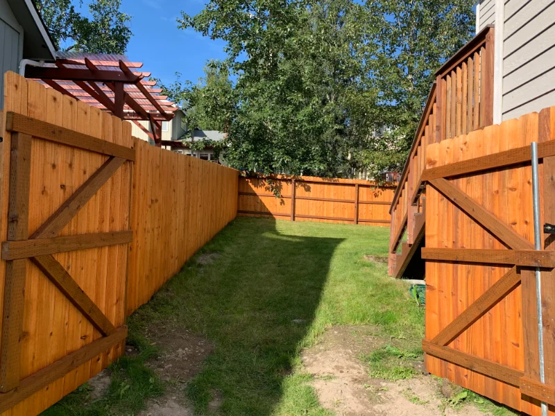 Cedar vs chain link fence comparison for Alaska